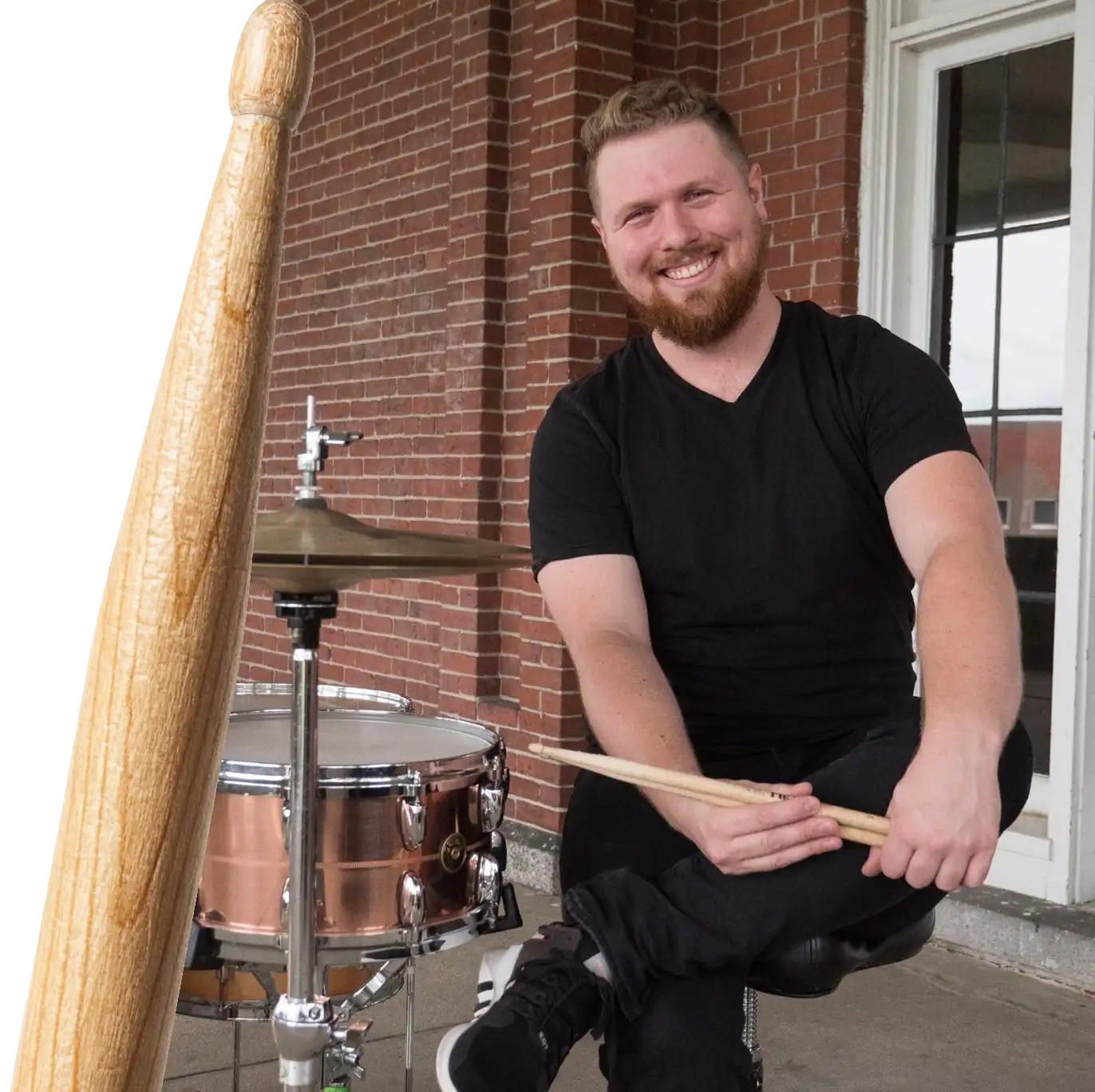 Devin Vaillancourt teaching drums